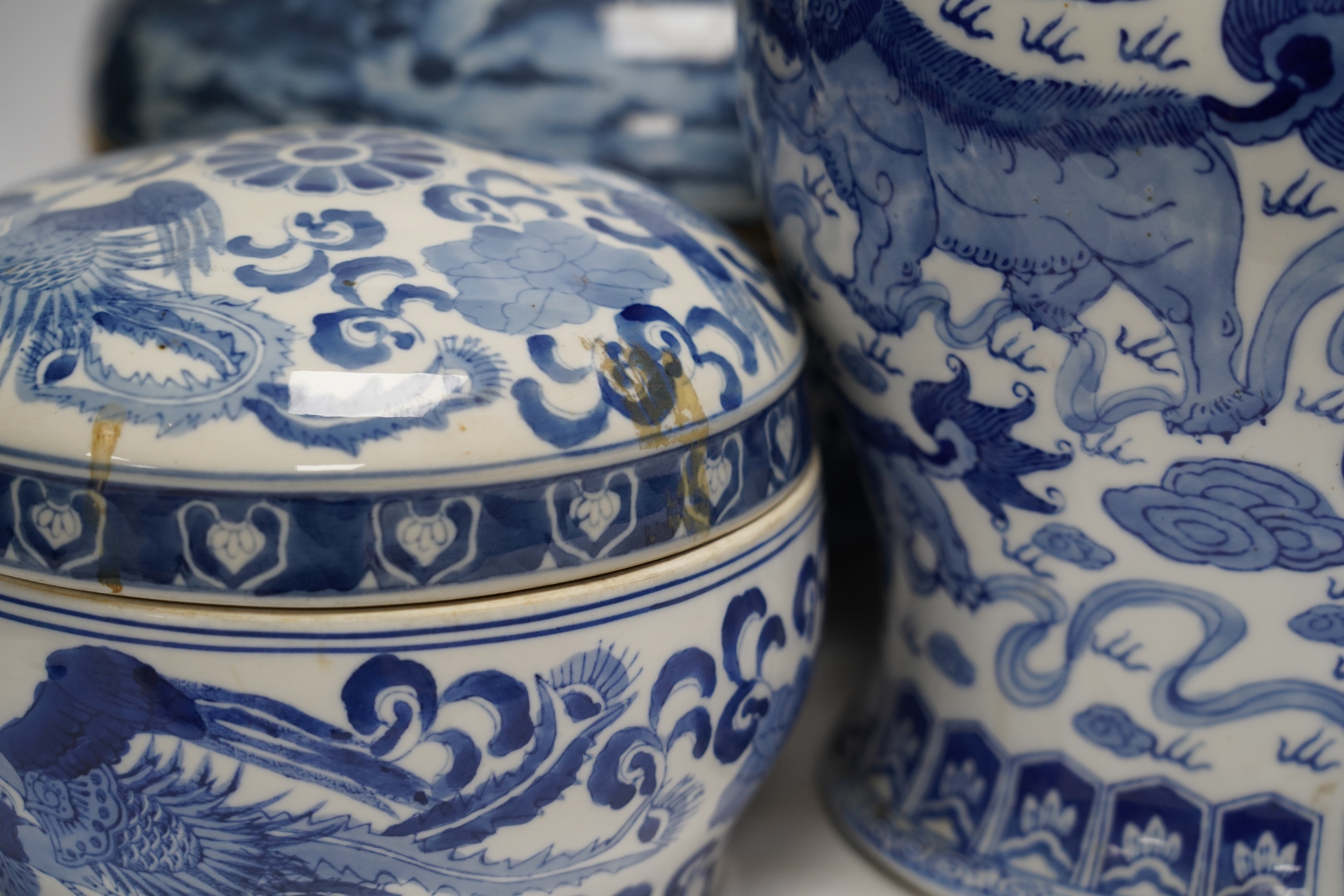 A 20th century Chinese blue and white vase and cover, a large bowl and cover and a smaller bowl and cover, tallest 44cm